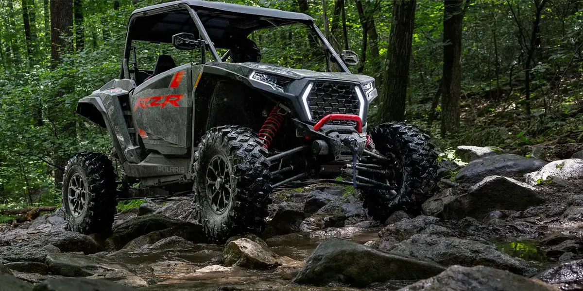 The new 2026 Polaris RZR XP kicking up dust on a rugged Central Texas trail